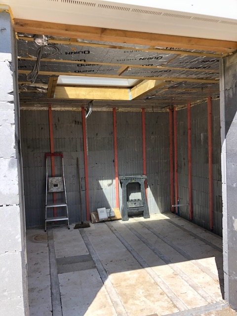 Inside the annex, looking towards a rooflight, walls lined and roof insulated